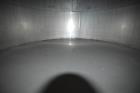 Used Tank, Approximate 19,500 Gallon, 14 Gauge Stainless steel, Vertical. Approximate 130” diameter x 336” straight side, coned top, 7” sloped bottom. Openings top 16” man way with cover and approxim...
