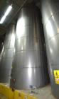 Used Tank, Approximate 19,500 Gallon, 14 Gauge Stainless steel, Vertical. Approximate 130” diameter x 336” straight side, coned top, 7” sloped bottom. Openings top 16” man way no cover and approximat...
