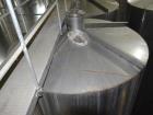 Used Tank, Approximate 19,500 Gallon, 14 Gauge Stainless steel, Vertical. Approximate 130” diameter x 336” straight side, coned top, 7” sloped bottom. Openings top 16” man way no cover and approximat...