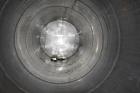 Used Tank, Approximate 19,500 Gallon, 14 Gauge Stainless steel, Vertical. Approximate 130” diameter x 336” straight side, coned top, 7” sloped bottom. Openings top 16” man way no cover and approximat...
