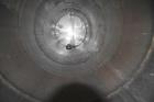 Used Tank, Approximate 19,500 Gallon, 14 Gauge Stainless steel, Vertical. Approximate 130” diameter x 336” straight side, coned top, 7” sloped bottom. Openings top 16” man way with cover and approxim...