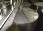 Used Tank, Approximate 19,500 Gallon, 14 Gauge Stainless steel, Vertical. Approximate 130” diameter x 336” straight side, coned top, 7” sloped bottom. Openings top 16” man way with cover and approxim...