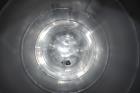 Used Tank, Approximate 19,500 Gallon, 14 Gauge Stainless steel, Vertical. Approximate 130” diameter x 336” straight side, coned top, 7” sloped bottom. Openings top 16” man way with cover and approxim...