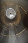 Used Tank, Approximate 19,500 Gallon, 14 Gauge Stainless steel, Vertical. Approximate 130” diameter x 336” straight side, coned top, 7” sloped bottom. Openings top 16” man way with cover and approxim...
