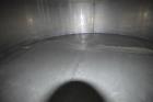 Used Tank, Approximate 19,500 Gallon, 14 Gauge Stainless steel, Vertical. Approximate 130” diameter x 336” straight side, coned top, 7” sloped bottom. Openings top 16” man way with cover and approxim...