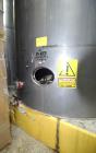 Used Tank, Approximate 19,500 Gallon, 14 Gauge Stainless steel, Vertical. Approximate 130” diameter x 336” straight side, coned top, 7” sloped bottom. Openings top 16” man way with cover and approxim...
