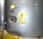 Used Tank, Approximate 19,500 Gallon, 14 Gauge Stainless steel, Vertical. Approximate 130” diameter x 336” straight side, coned top, 7” sloped bottom. Openings top 16” man way with cover and approxim...