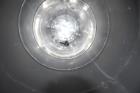 Used Tank, Approximate 19,500 Gallon, 14 Gauge Stainless steel, Vertical. Approximate 130” diameter x 336” straight side, coned top, 7” sloped bottom. Openings top 16” man way with cover and approxim...