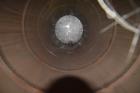 Used Tank, Approximate 19,500 Gallon, 14 Gauge Stainless steel, Vertical. Approximate 130” diameter x 336” straight side, coned top, 7” sloped bottom. Openings top 16” man way with cover and approxim...
