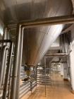 Used Holvrieka Ido BV. vertical tank. Capacity 58201 gallon/220000-liter, 304 stainless steel on product contact parts. 15.10