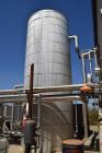 Used Tank, Approximate 10,000 Gallon, Stainless Steel, Vertical. Approximate 120