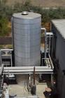 Used Tank, Approximate 10,000 Gallon, Stainless Steel, Vertical. Approximate 120