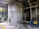 Used 11,000 Gallon 316 Stainless Steel Vertical Tank. Approximately 12' diameter x 13' tall. Side manway. Flat top.