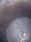 USED: 7500 gallon, 304 stainless steel, vertical tank. Slight dishtop, flat bottom, 10' diameter x 13' overall height, insulated.Last used to store latex.