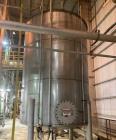 Used Approximate 9000 gallon Stainless Steel Storage Tank With 5 HP Centrifugal Pump, V-4780. approximate 120' X 15' T/T. Misc. top inlets. Cone bottom with center bottom outlet. Bottom side manway. ...