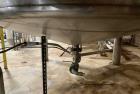 Used Approximate 9000 gallon Stainless Steel Storage Tank With 5 HP Centrifugal Pump, V-4780. approximate 120' X 15' T/T. Misc. top inlets. Cone bottom with center bottom outlet. Bottom side manway. ...
