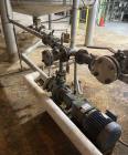 Used Approximate 9000 gallon Stainless Steel Storage Tank With 5 HP Centrifugal Pump, V-4780. approximate 120' X 15' T/T. Misc. top inlets. Cone bottom with center bottom outlet. Bottom side manway. ...