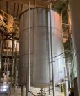 Used Approximate 9000 gallon Stainless Steel Storage Tank With 5 HP Centrifugal Pump, V-4780. approximate 120' X 15' T/T. Misc. top inlets. Cone bottom with center bottom outlet. Bottom side manway. ...