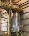 Used Approximate 6,750 gallon Stainless Steel Tank With Diaphragm Pump, V-4332. Flat top with misc. inlets & openings. Cone bottom with center bottom outlet. Side bottom manway. Has stainless steel l...