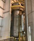 Used Approximate 6,750 gallon Stainless Steel Tank With Diaphragm Pump, V-4332. Flat top with misc. inlets & openings. Cone bottom with center bottom outlet. Side bottom manway. Has stainless steel l...