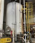 Used Approximate 8,680 gallon 316L Stainless Steel Agitated Tank With Goulds Centrifugal Pump. V-4508, P-4203.  Atmos. at 212 degrees F internal pressure. Top entering Agitator (HP unknown). Cone bot...