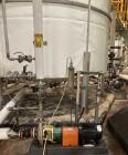 Used Approximate 8000 gallon Stainless Steel Tank With Centrifugal Pump, V-1108. Flat top with misc. top inlets. Cone bottom with center bottom outlet. Insulated shell. Worthington Centrifugal Pump, ...