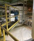 Used Approximate 8000 gallon Stainless Steel Mixing Tank With Centrifugal Pump, V-4506. Flat top with misc. top inlets. Cone bottom with center bottom outlet. Insulated shell. Top entering Chemineer ...
