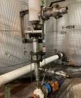 Used Approximate 8000 gallon Stainless Steel Mixing Tank With Centrifugal Pump, V-4506. Flat top with misc. top inlets. Cone bottom with center bottom outlet. Insulated shell. Top entering Chemineer ...