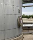 Used Approximate 80,000 gallon 316L Stainless Steel Storage Tank, T-1018. Dished top with misc. top inlets. Flat self supporting bottom. 20