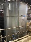Wolfe Mechanical approximately 12,600 gallon 304L stainless steel vertical tank.
