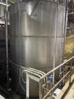 Wolfe Mechanical approximately 12,600 gallon 304L stainless steel vertical tank.