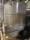 Wolfe Mechanical approximately 12,600 gallon 304L stainless steel vertical tank.