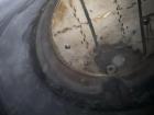 Wolfe Mechanical approximately 12,600 gallon 304L stainless steel vertical tank.
