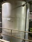 Wolfe Mechanical approximately 12,600 gallon 304L stainless steel vertical tank.