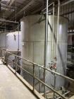 Wolfe Mechanical approximately 12,600 gallon 304L stainless steel vertical tank.