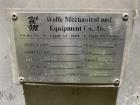 Wolfe Mechanical approximately 12,600 gallon 304L stainless steel vertical tank.
