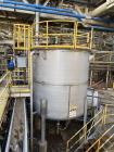 Used Vertical Stainless Steel Tank, Approx. 6,000 gallon capacity.