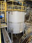 Used Vertical Stainless Steel Tank, Approx. 6,000 gallon capacity.