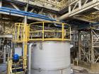 Used Vertical Stainless Steel Tank, Approx. 6,000 gallon capacity.