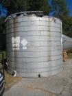 Used 11,000 gallon stainless steel storage tank, approximately 12'6