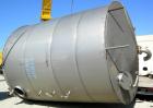 USED: Tank, 10,000 gallon, 304 stainless steel, vertical. Approximate 11' diameter x 14' straight side. Coned top, sloped bottom. Openings: top 18