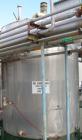 USED: Approximate 6000 gallon stainless steel mix tank. Approximate 9' diameter x 140