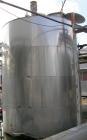 USED: Approximate 6000 gallon stainless steel mix tank. Approximate 9' diameter x 140