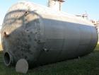 USED: Approximate 14,000 gallon stainless steel storage tank. Vertical, dished heads, 5' skirt bottom. 11'6