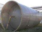 USED: Approximate 14,000 gallon stainless steel storage tank. Vertical, dished heads, 5' skirt bottom. 11'6