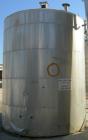 USED: Tank, 7,000 gallon, stainless steel, insulated, vertical. 10' diameter x 12' straight side. Dish top, flat bottom. Top openings: manway with cover, misc top openings. Shaft and impeller driven ...