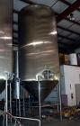 Used Apache Tank, 6500 Gallon, 316 Stainless Steel, Vertical. Approximate 102” diameter x 172” straight side. Dished top, 70” coned bottom. Side entering agitator with a 3 blade prop, driven by a 3hp...