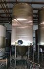 Used Apache Tank, 6500 Gallon, 316 Stainless Steel, Vertical. Approximate 102” diameter x 172” straight side. Dished top, 70” coned bottom. Side entering agitator with a 3 blade prop, driven by a 3hp...