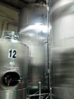Used- Cherry Burrell 9,000 Gallon Side Agitated Mixing Tank, Model 9000 CV. Dome top / bottom, spray ball, side manway, side...