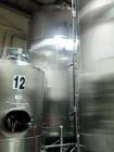 Used Cherry Burrell 9,000 Gallon Side Agitated Mixing Tank, Model 9000 CV. Dome top / bottom, spray ball, side manway, side agitation, bottom discharge. 17' straight wall, 20' overall height, 9' 4